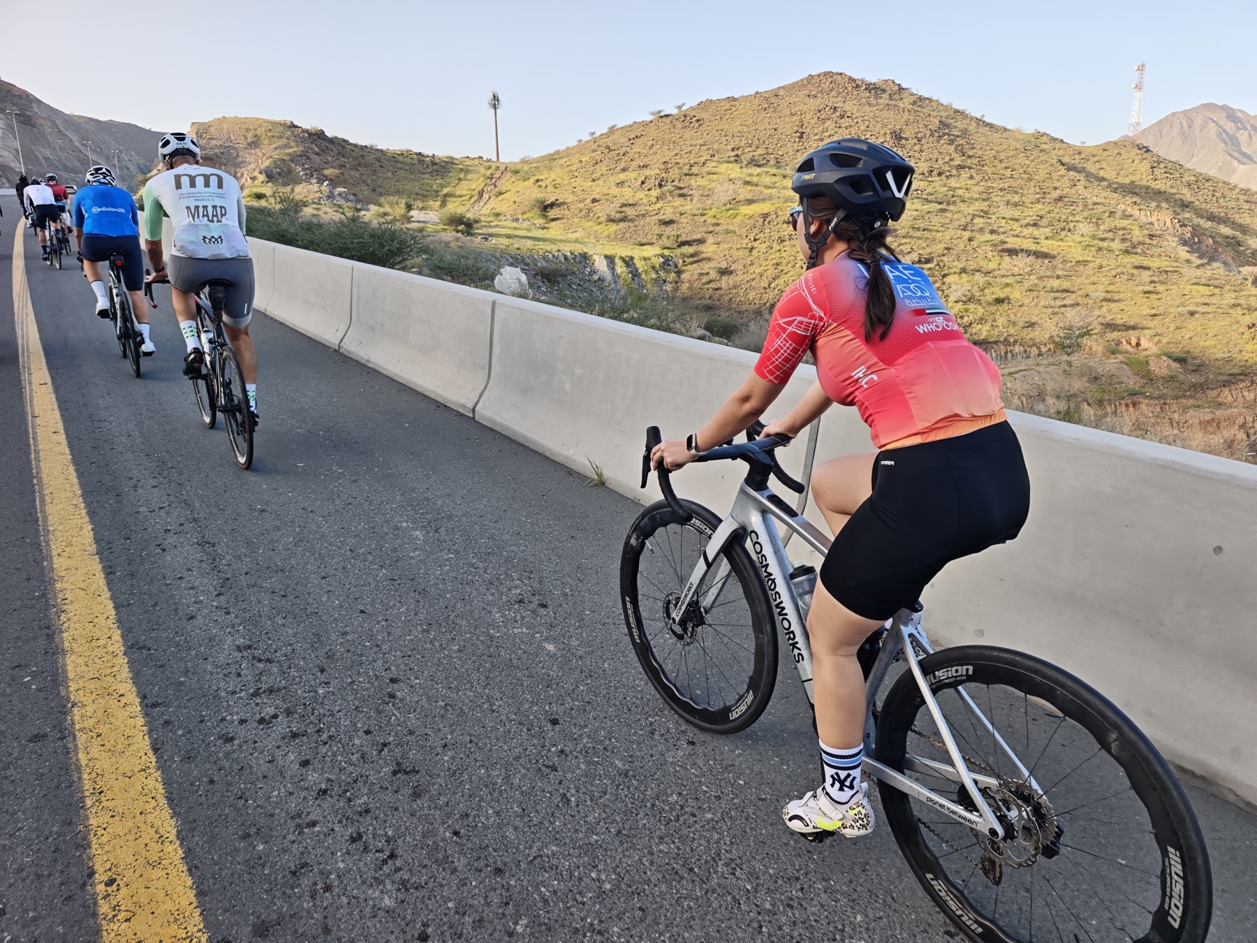 Riders climbing together in UAE mountains