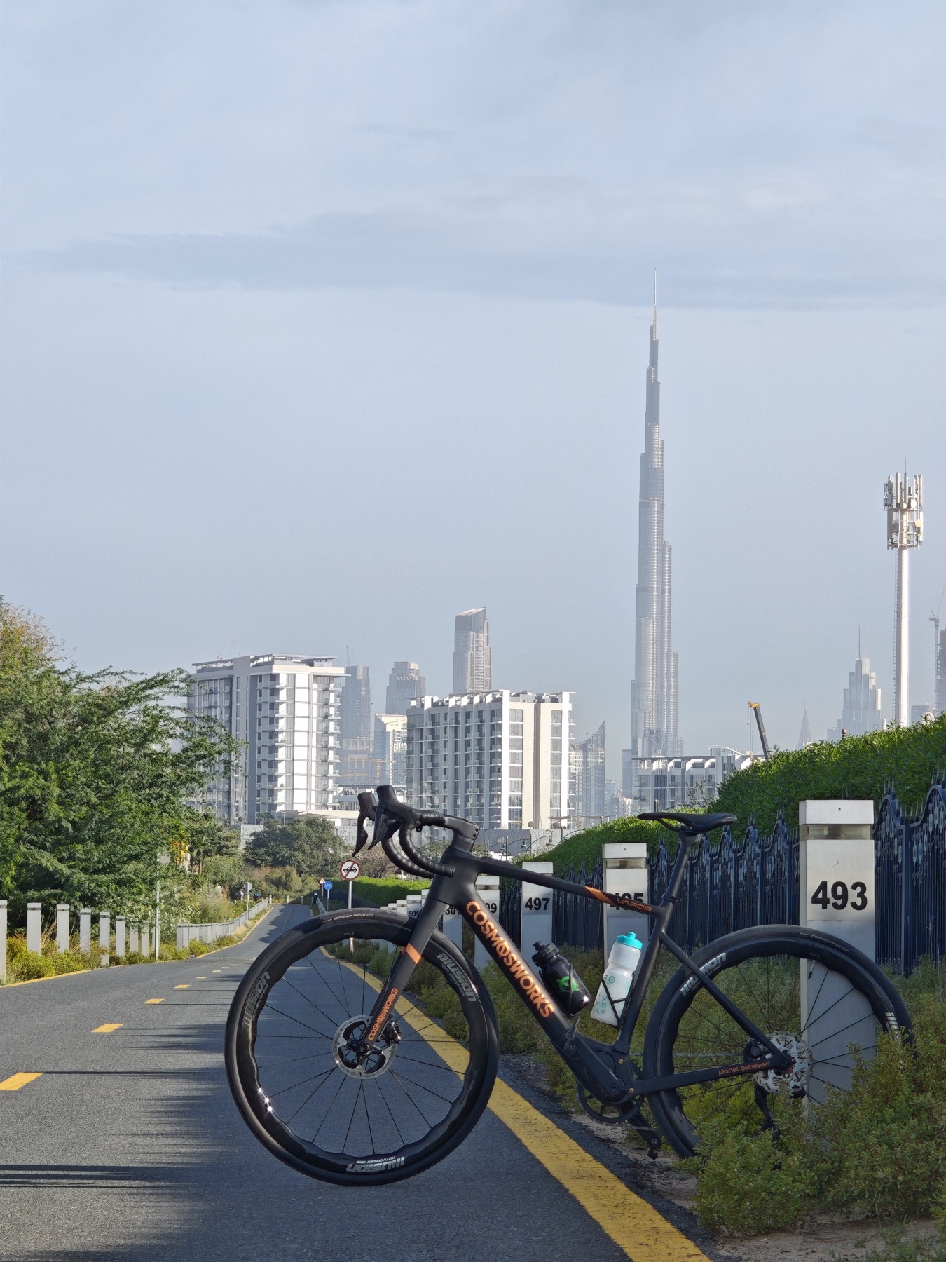 Cosmos VAPOR electric road bike with Burj Khalifa in Dubai